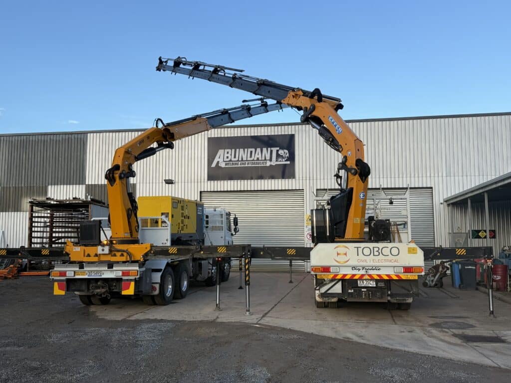 Two cranes extended.